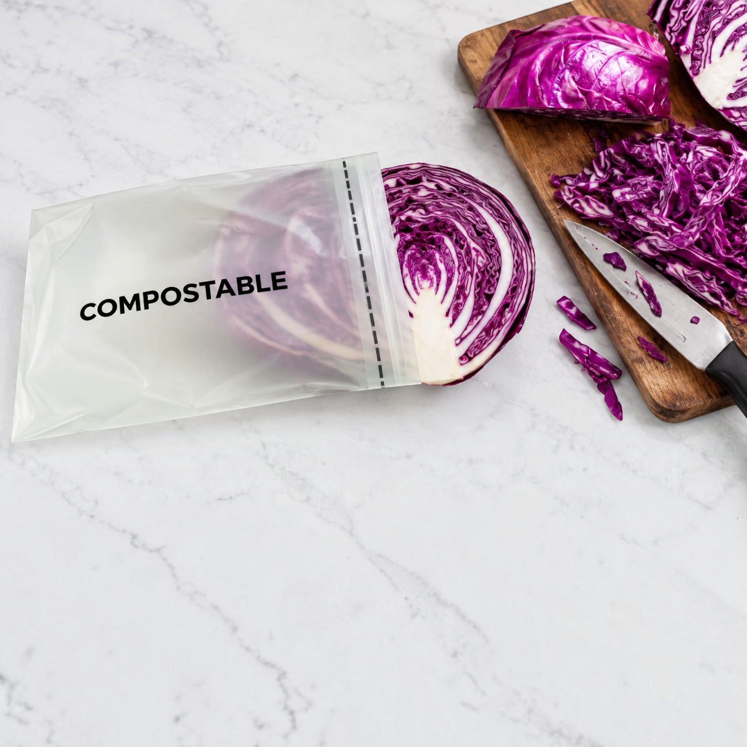 Eco Disposable Tableware compostable storage bag containing sliced red cabbage on a marble countertop