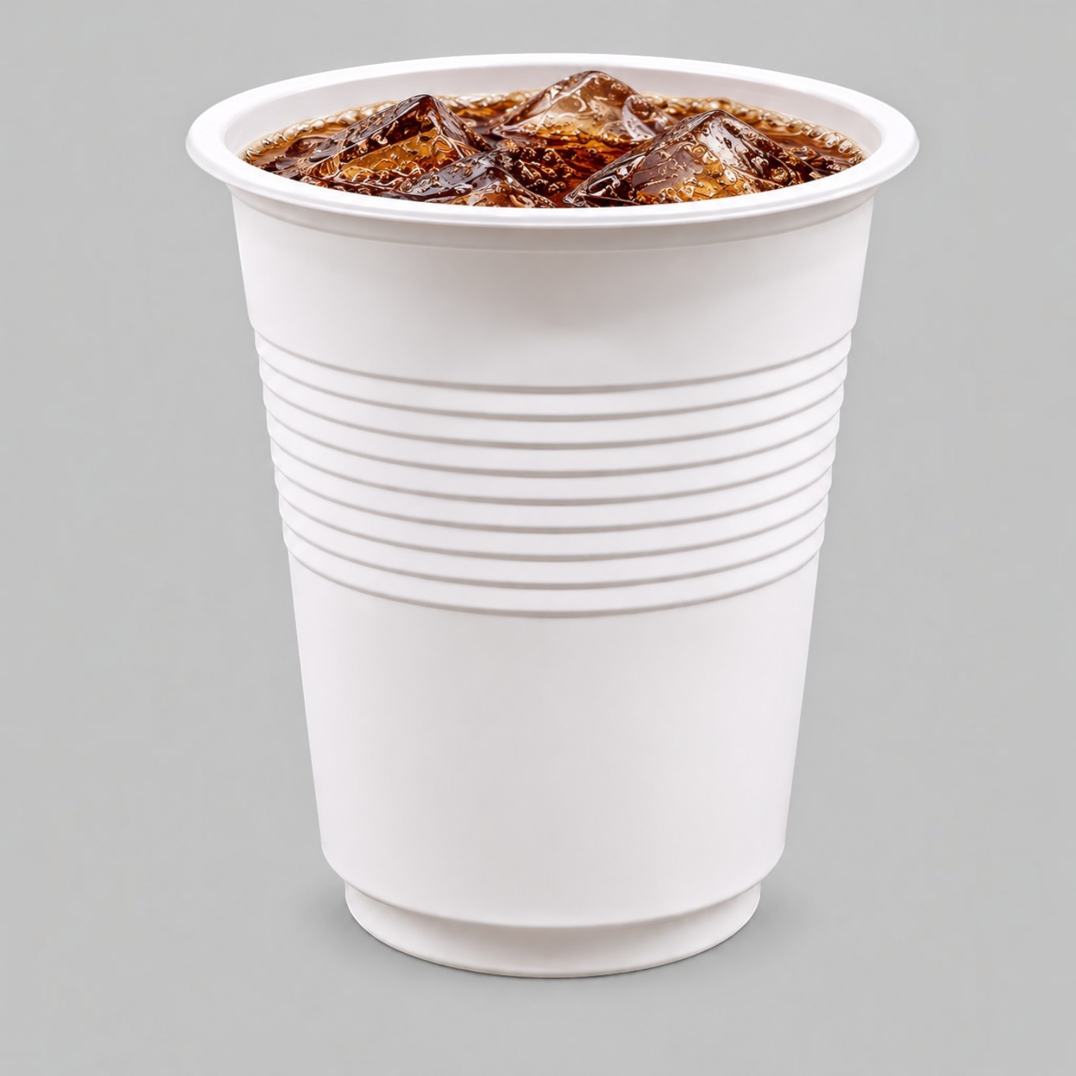 Eco Disposable Tableware white compostable cold drink cup filled with iced beverage on a neutral grey background